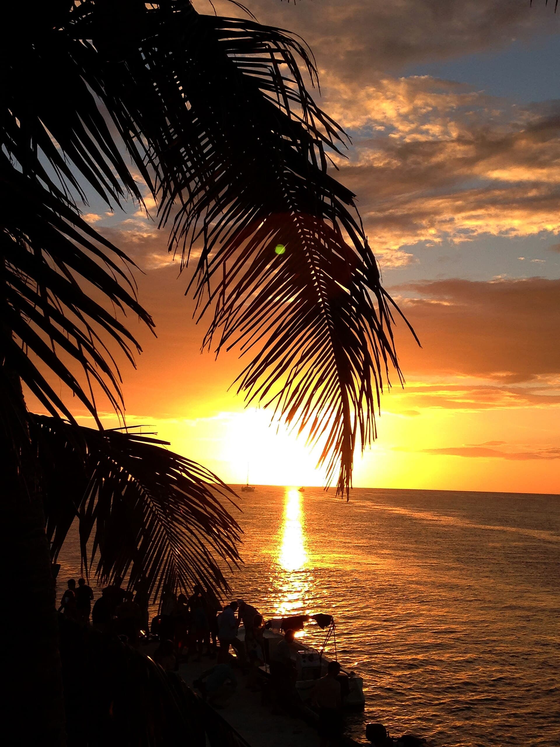 Sunset over the water at the Split — Caye Caulker, Belize