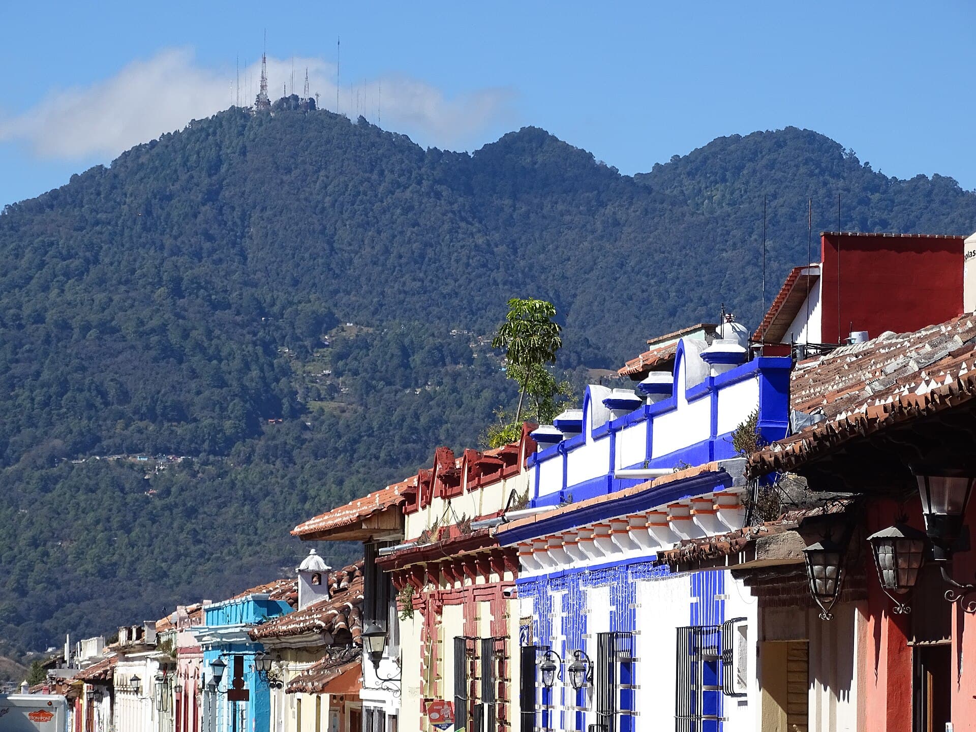 A colorful street with the mountains behind — San Cristóbal de las Casas, Mexico